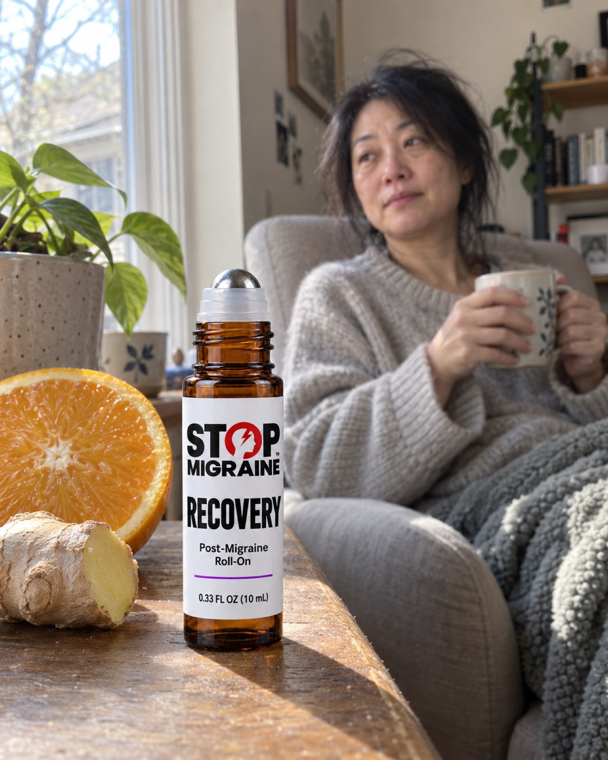 The morning after a migraine: a woman with tea by the window, STOP MIGRAINE RECOVERY on the sill