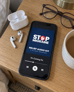 Relief Audio Kit playing on a phone next to earbuds