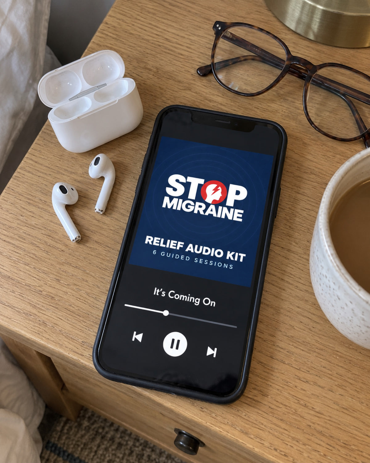 Relief Audio Kit playing on a phone next to earbuds